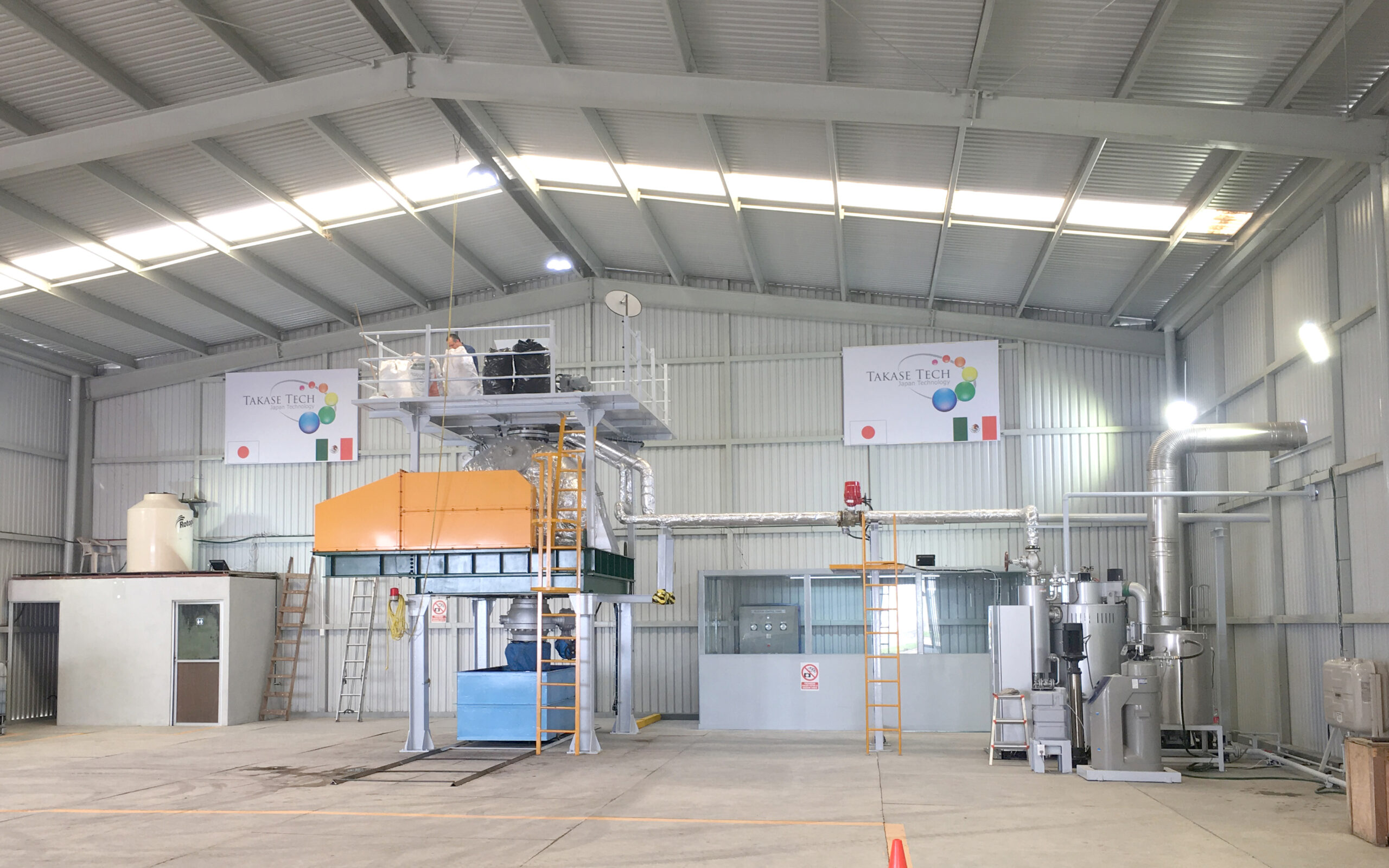 Industrial facility interior with large machinery and equipment